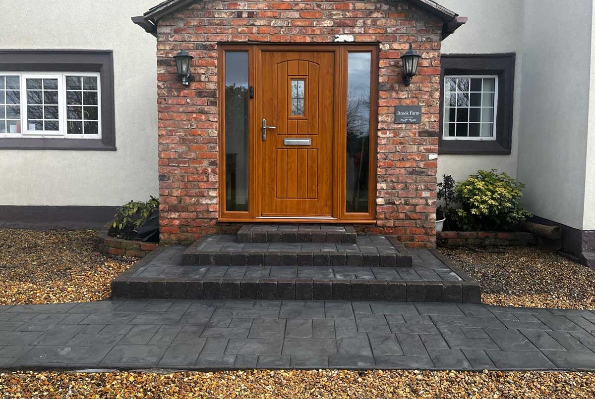 After — curved Ashlar Sandstone pathway with Charcoal Melifont kerbs