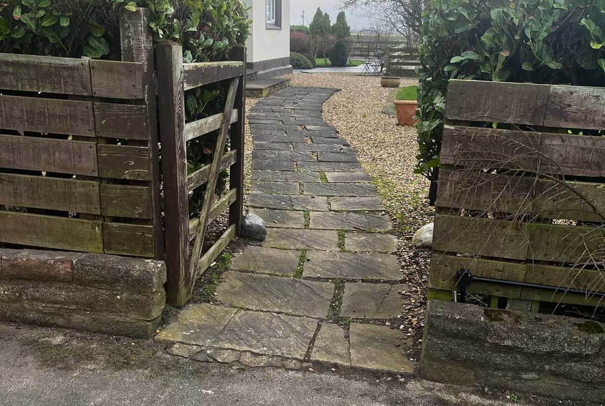 Curved Ashlar Sandstone pathway with Melifont Charcoal kerb steps at Brook Farm Bickerstaff